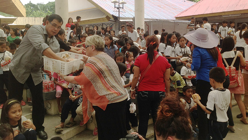 Giving out Tom’s shoes in the Philippines